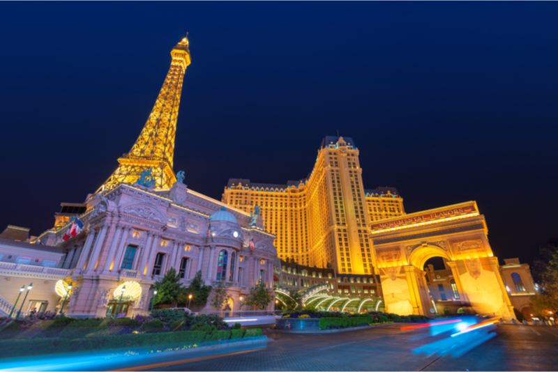 View across lake to replica Eiffel Tower at the Paris Hotel and Casino,  Bellagio fountains in