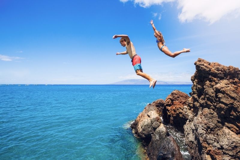 cliff jumping in Cala Tarida, Ibiza